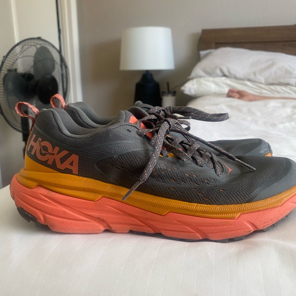 A pair of hoka trail running shoes